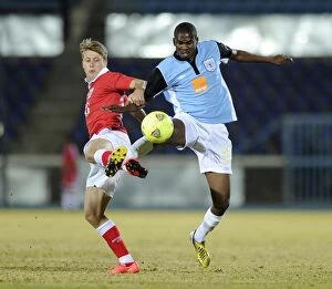 Images Dated 24th July 2014: Bristol City's Luke Freeman Faces Off Against Mosha Gaolaolwe of Botswana in Pre-Season Friendly