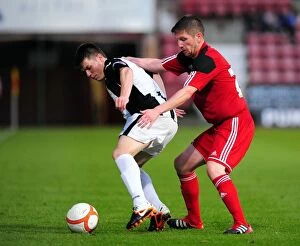 Images Dated 1st August 2012: Bristol City's Mark Wilson vs. Dunfermline's Alex Whittle: A Battle for the Ball in Pre-Season