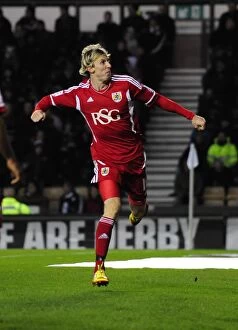 Images Dated 10th December 2011: Bristol City's Martyn Woolford Celebrates Goal Against Derby County in Championship Match