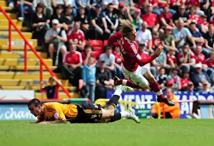 Bristol City's Martyn Woolford Fouled by Hull's Jack Hobbs during Championship Match