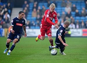 Millwall v Bristol City Collection: Bristol City's Martyn Woolford Outmaneuvers Millwall Defense in 2011 Championship Match