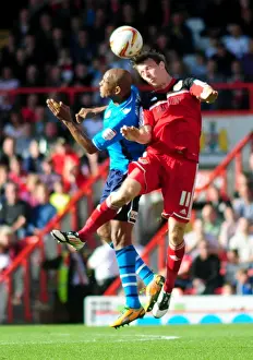 Framed Print : Bristol City's Martyn Woolford Outmuscles Rodolph Austin for the Header in Championship Clash against Leeds United Framed Print : Bristol City's Martyn Woolford Outmuscles Rodolph Austin for the Header in Championship Clash against Leeds United