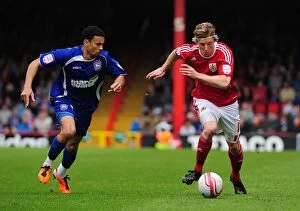 Bristol City v Ipswich Town Collection: Bristol City's Martyn Woolford Outsmarts Carlos Edwards in Championship Showdown at Ashton Gate