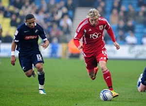 Millwall v Bristol City Collection: Bristol City's Martyn Woolford Outsmarts Liam Feeney in 2011 Championship Showdown