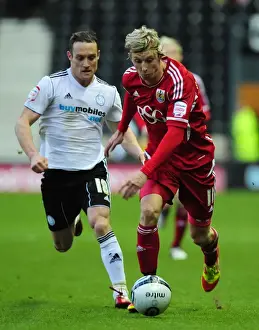 Derby County V Bristol City Prints: Bristol City's Martyn Woolford vs Ben Davies in Derby County Championship Clash - 10/12/2011