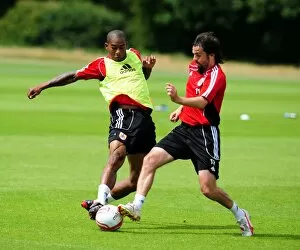 Images Dated 6th July 2010: Bristol Citys Marvin Elliott battles for the ball with Bristol Citys Paul Hartley