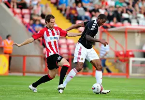 Bristol Citys Marvin Elliott battles for the ball with Ryan Harley