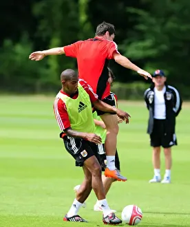 Bristol Citys Marvin Elliott challenges for the ariel ball with Bristol Citys Ivan Sproule
