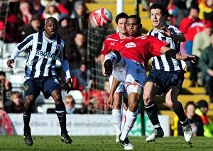 Images Dated 21st February 2010: Bristol City's Marvin Elliott Clears Ball from Robert Koren as Youssuf Mulumbu Looks On