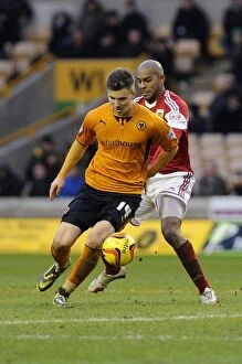 Images Dated 25th January 2014: Bristol City's Marvin Elliott Closes In on Wolverhampton Wanderers Lee Evans in Sky Bet League One