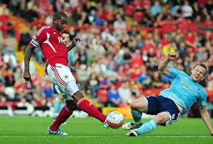 Bristol City V Hull City Prints: Bristol City's Marvin Elliott Fouled by Hull City's Paul McKenna during Championship Match