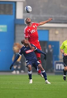 Millwall v Bristol City Collection: Bristol City's Marvin Elliott vs. Jimmy Abdou: A Battle for Supremacy in the Millwall vs