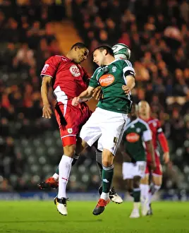 Bristol City V Plymouth Argyle Prints: Bristol City's Marvin Elliott vs Plymouth Argyle's Carl Fletcher