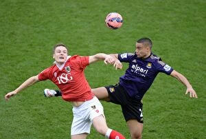 Images Dated 25th January 2015: Bristol City's Matt Smith Battles for High Ball Against West Ham's Winston Reid during FA Cup