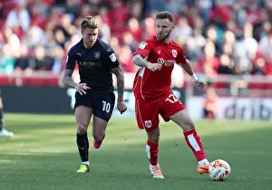 Bristol City's Matt Taylor Evades George Moncur in Thrilling Championship Clash