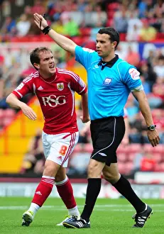 Bristol City V Brighton Prints: Bristol City's Neil Kilkenny Argues with Referee during Championship Match against Brighton (10-09-2011)