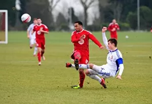 Images Dated 9th February 2011: Bristol Citys Nicky Maynard battles for the ball with the Swindon Defence