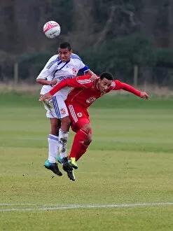 Images Dated 9th February 2011: Bristol Citys Nicky Maynard battles for the high ball with the Swindon Defence