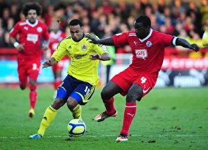 Crawley Town v Bristol City Collection: Bristol City's Nicky Maynard Clashes with Crawley Town's Pablo Mills in FA Cup Match - 07/01/2012