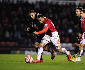 Images Dated 23rd March 2010: Bristol City's Nicky Maynard Fights for Possession Against Barnsley in Championship Match, 2010