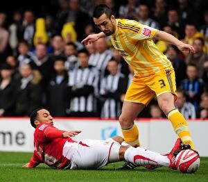 Bristol City v Newcastle Utd Collection: Bristol City's Nicky Maynard vs. Newcastle United's Jose Enrique - Intense Battle for the Ball