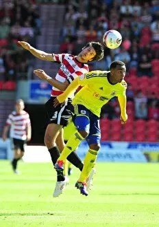 Doncaster Rovers v Bristol City Collection: Bristol City's Nicky Maynard vs. Doncaster Rovers George Friend in League Cup Clash - 27/08/2011