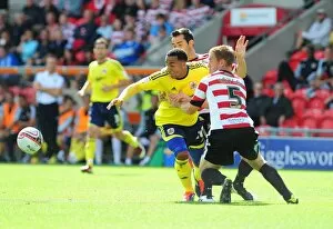 Images Dated 27th August 2011: Bristol City's Nicky Maynard vs Doncaster Rovers Richard Naylor in League Cup Clash, 27/08/2011