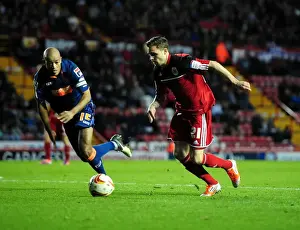 Bristol City V Blackpool Prints: Bristol City's Paul Anderson Outmaneuvers Blackpool's Alex John-Baptiste in Championship Clash