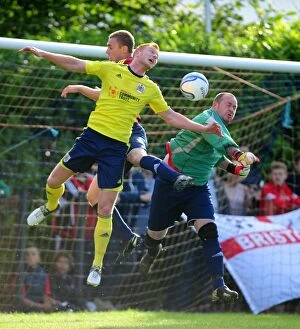 Images Dated 3rd July 2013: Bristol City's Ryan Taylor Battles for a Header in Pre-Season Friendly Against Ashton