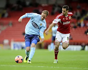 Bristol City's Sam Baldock Chases Down Dagenham & Redbridge's Scott Doe in FA Cup Action at Ashton Gate