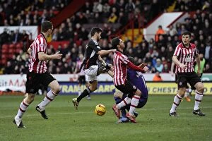 Images Dated 22nd February 2014: Bristol City's Sam Baldock Clashes with Sheffield United's Mark Howard - Football Rivalry at