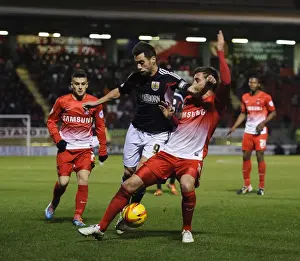 Leyton Prints: Bristol City's Sam Baldock Faces Off Against Leyton Orient's Gary Sawyer in Sky Bet Football League 1 Clash