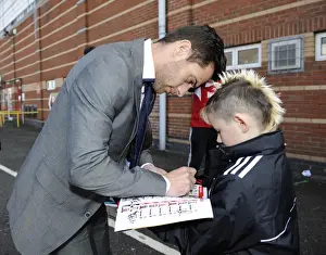 Bristol City V Gillingham Prints: Bristol City's Sam Baldock Signs Young Fan's Programme During Bristol City vs Gillingham Match