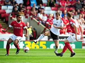 Images Dated 1st September 2012: Bristol City's Sam Baldock Tries to Squeeze Past Barnsley's Defenders