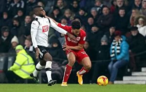 Images Dated 11th February 2017: Bristol City's Scott Golbourne Fends Off Abdoul Camara in Derby County Clash