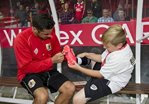 Images Dated 16th August 2014: Bristol City's Scott Murray Signs Young Fan's Football Boot at Ashton Gate