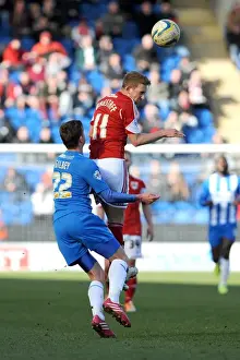 Colchester United V Bristol City Prints: Bristol City's Scott Wagstaff Battles for a Header Against Colchester United's Alex Gilbey during Sky Bet