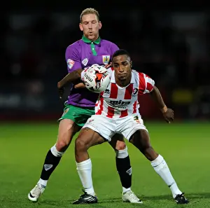 Bristol City's Scott Wagstaff Closes In on Cheltenham Town's Craig Braham-Barrett in Johnstone's Paint Trophy Clash