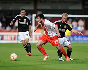 Stevenage V Bristol City Prints: Bristol City's Simon Gillett Closes In on Michael Doughty in Intense Stevenage Showdown