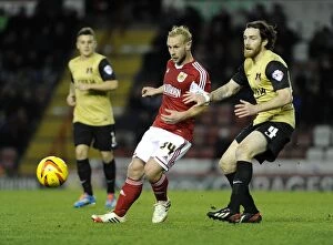 Images Dated 26th November 2013: Bristol City's Simon Gillett Evades Challenge from Leyton Orient's Romain Vincelot