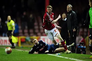 Bristol City V Millwall Prints: Bristol City's Stephen Pearson Dodges Alan Dunne's Tackle in Intense Championship Clash (03/01/2012)