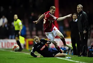 Bristol City V Millwall Prints: Bristol City's Stephen Pearson Dodges Tackle from Millwall's Alan Dunne - Championship Match (03/01/2012)