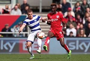 Images Dated 14th April 2017: Bristol City's Tammy Abraham Slips Past QPR's Jake Bidwell in Championship Clash