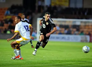 Framed Print : Bristol Citys trialist Tom Williams goes past the torquay defence