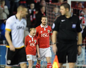 Images Dated 10th February 2015: Bristol City's Wade Elliott and Mascot Celebrate at Ashton Gate during Bristol City vs Port Vale