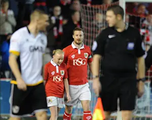 Bristol City's Wade Elliott and Mascot Celebrate at Ashton Gate during Bristol City vs Port Vale, Sky Bet League One Match, February 10, 2015