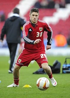 Images Dated 5th January 2013: Bristol City's Wes Burns on the Bench: FA Cup Match against Blackburn Rovers (05/01/2013)