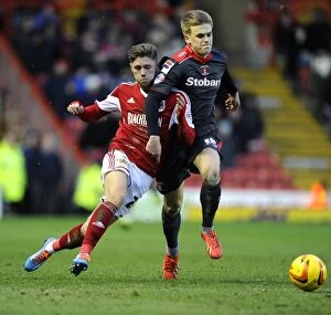 Images Dated 1st February 2014: Bristol City's Wes Burns vs Carlisle United's Brad Potts: A Football Rivalry in Sky Bet League One