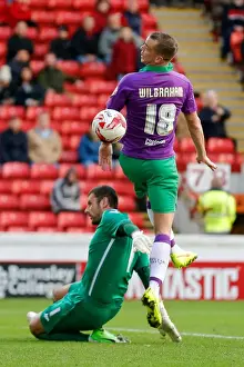 Barnsley V Bristol City Prints: Bristol City's Wilbraham Heads the Ball Against Barnsley's Turnbull - Football Rivalry at Oakwell Stadium