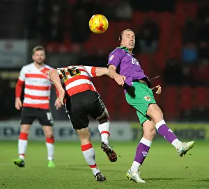 Framed Print : Bristol City's Wilbraham vs. Butler: Heading Battle at Doncaster's Keepmoat Stadium, 2015 Framed Print : Bristol City's Wilbraham vs. Butler: Heading Battle at Doncaster's Keepmoat Stadium, 2015